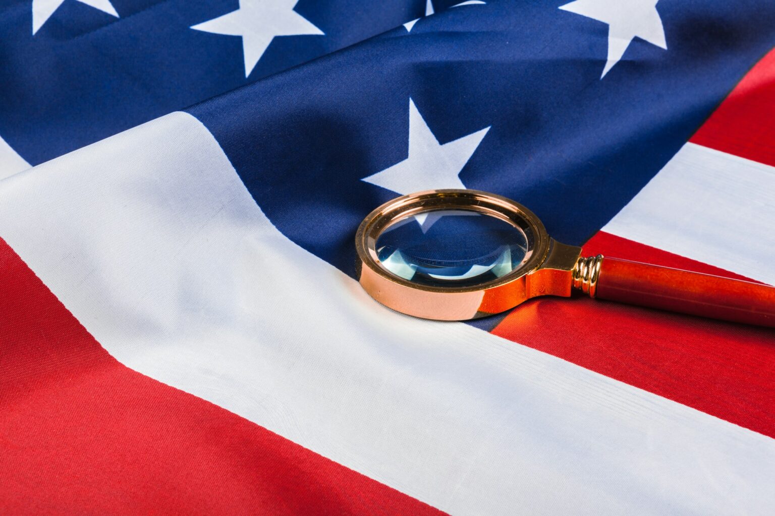 Flag of USA and a magnifying glass